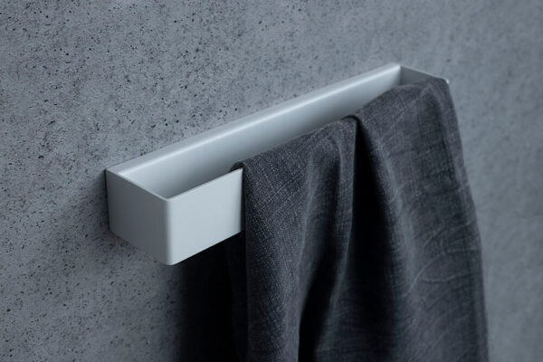 TU10 white towel holder mounted on bathroom wall with hidden fixings
